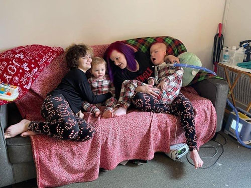 The Johnson family sitting on a couch